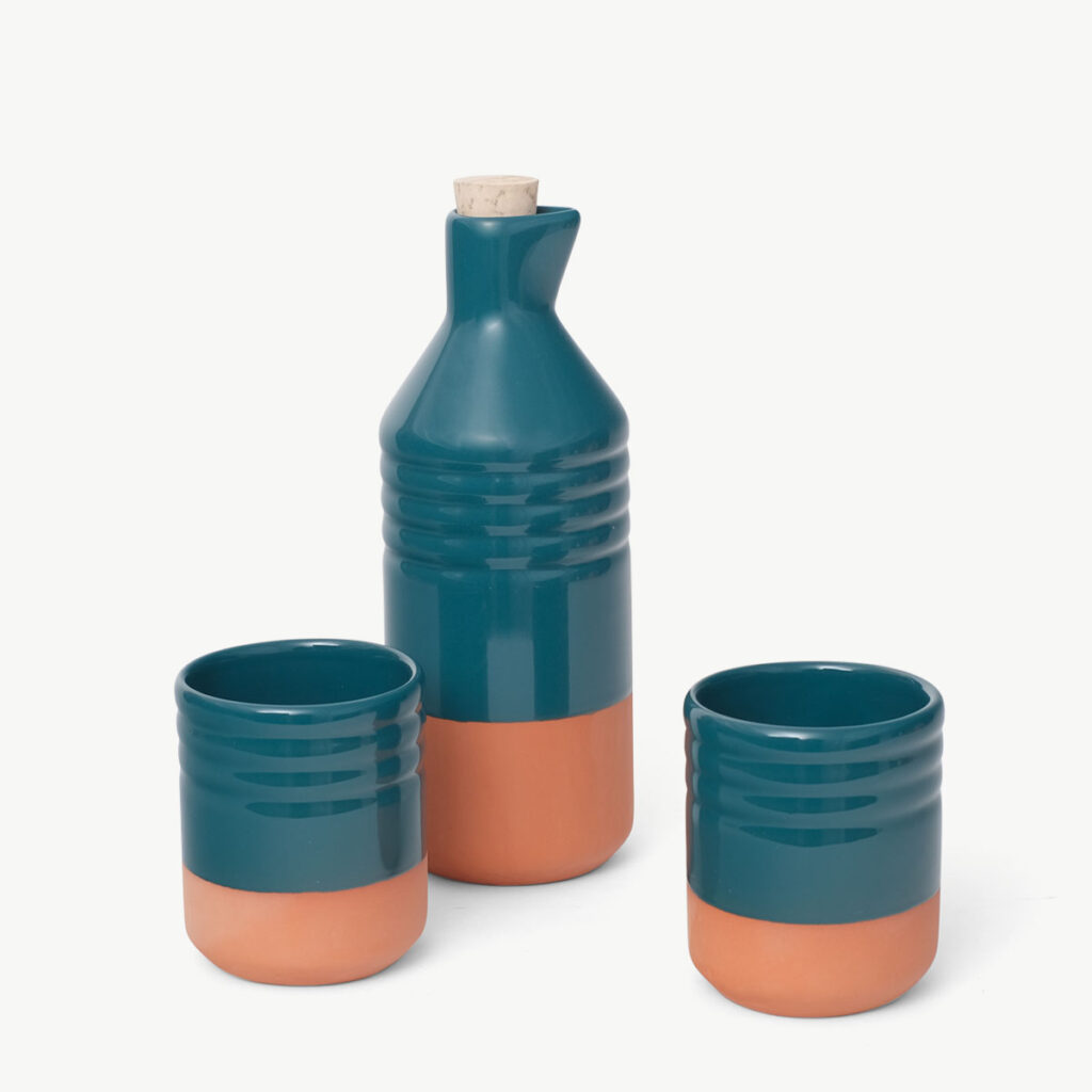 Ceramic pitcher and two cups produced in Europe